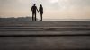 Silhouette of romantic couple holding their hands